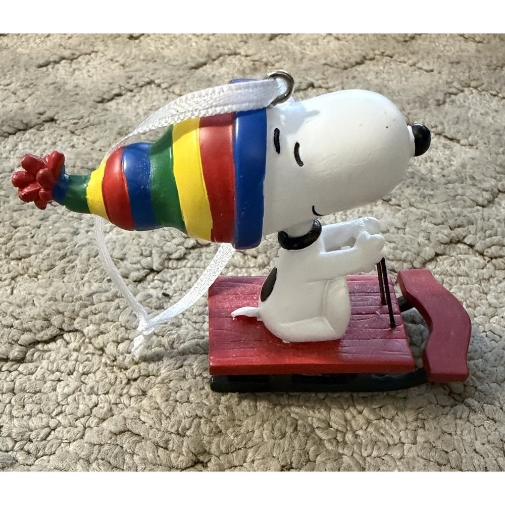 Hallmark Ornament Peanuts Snoopy on Sled with Rainbow Hat
